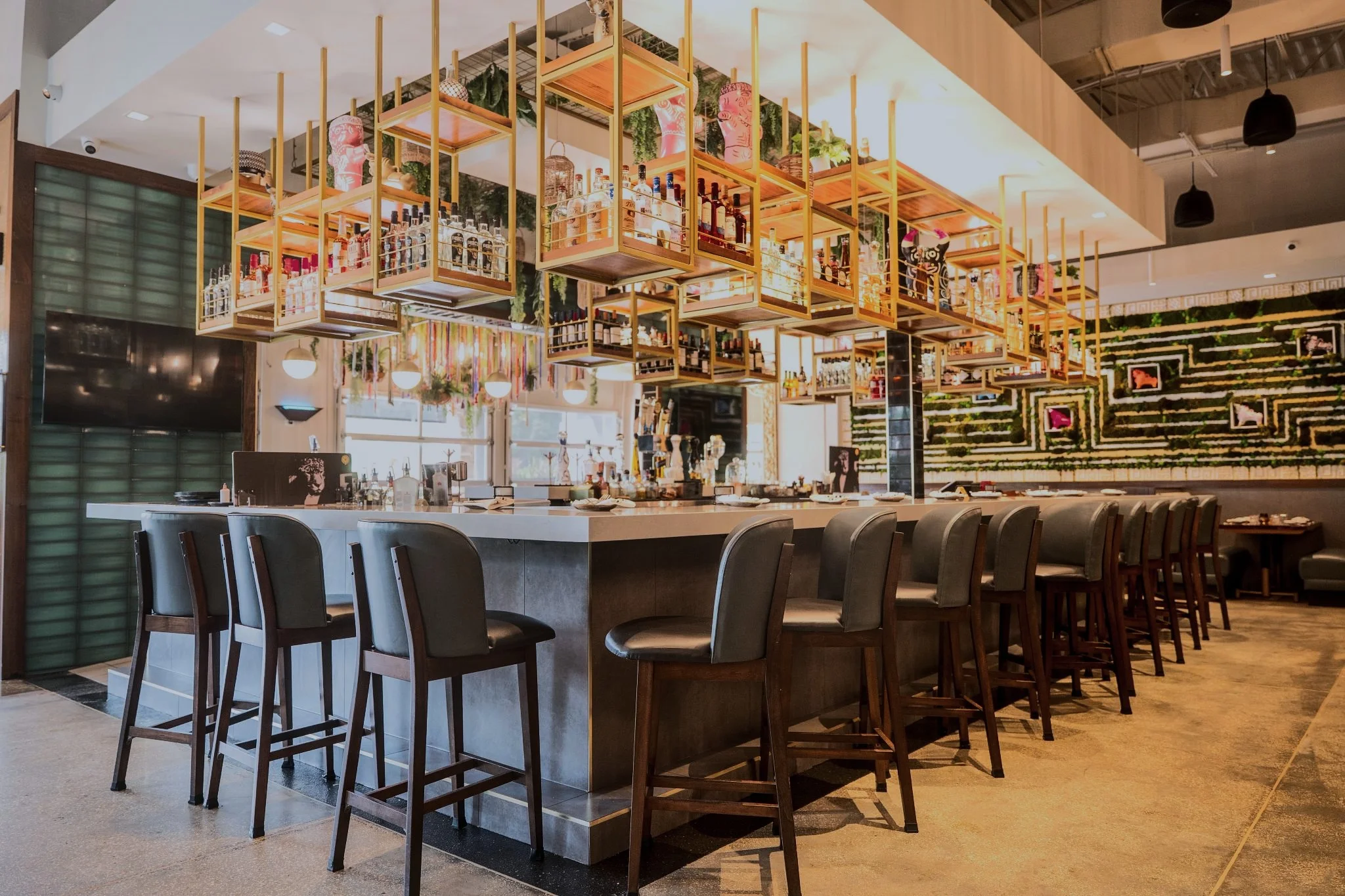 The gold-accented bar inside Pisco Peruvian Gastrobar