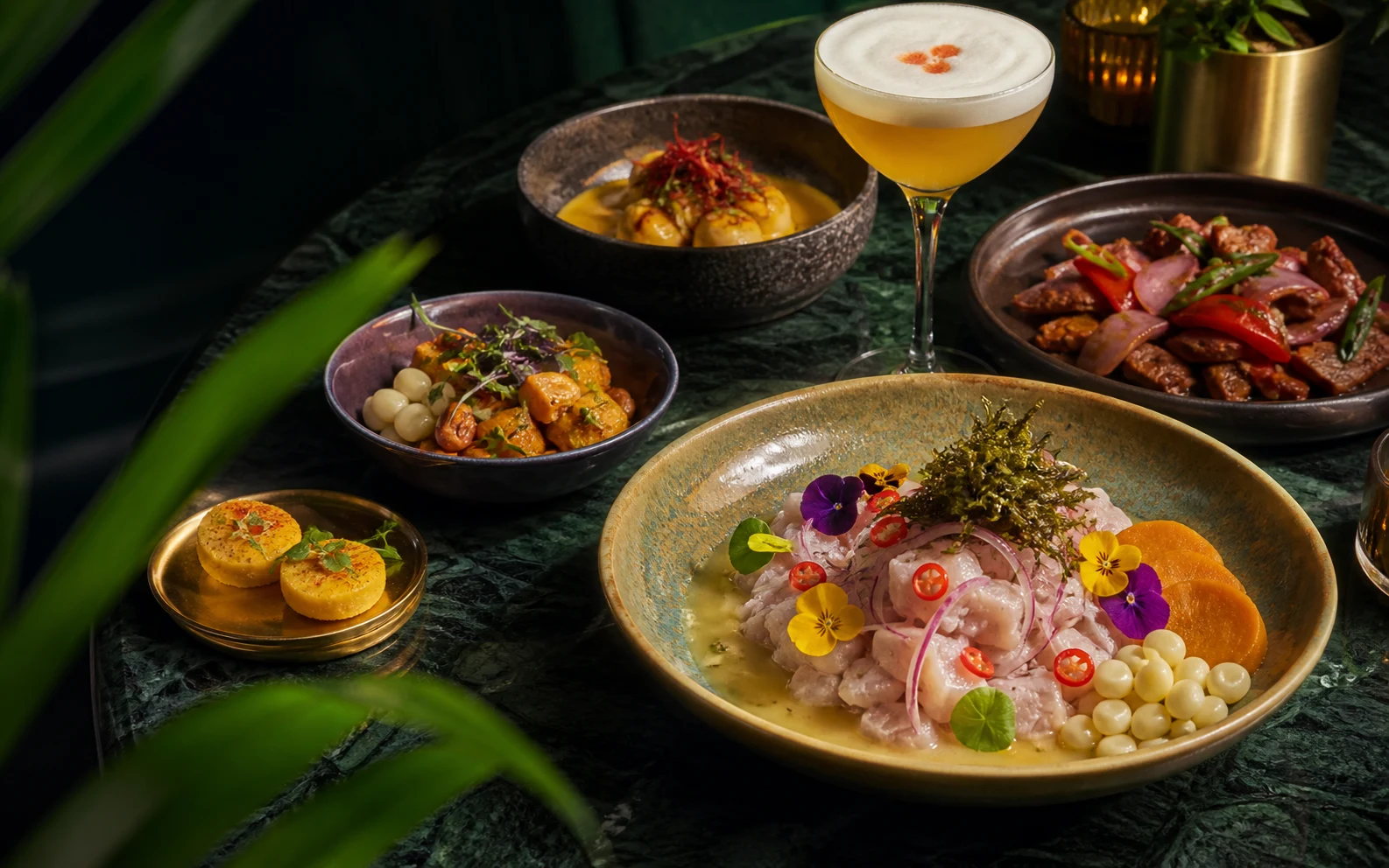 A refined Peruvian feast with ceviche, lomo saltado, causa, and a pisco sour