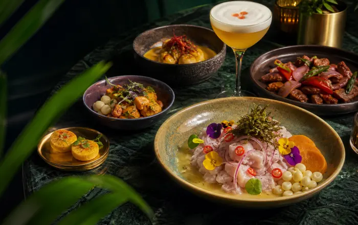 A table of composed Peruvian dishes